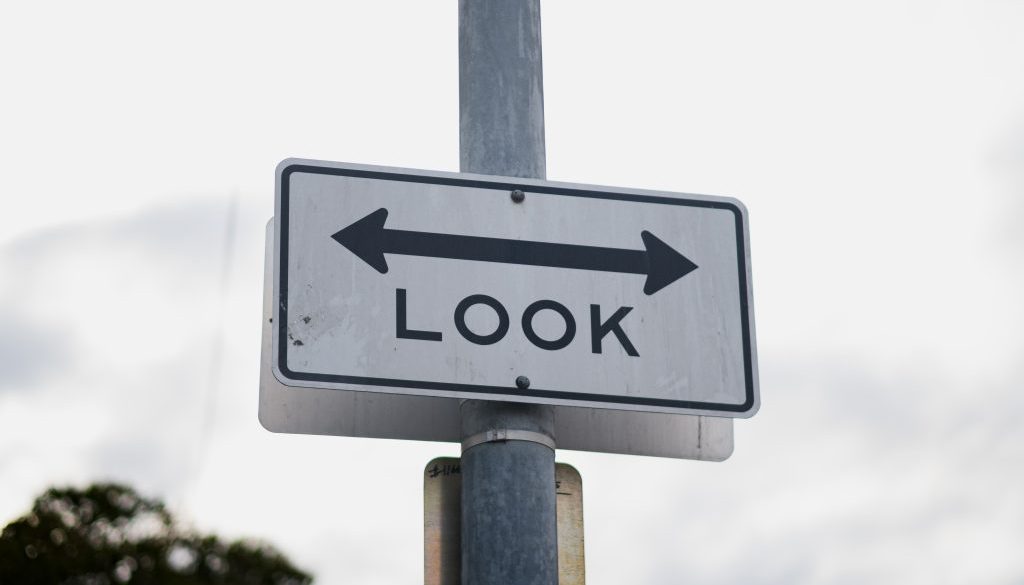 "Look" sign with double ended arrow