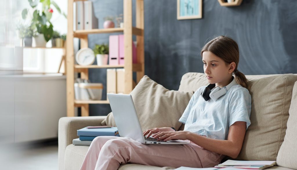 Teen working on laptop