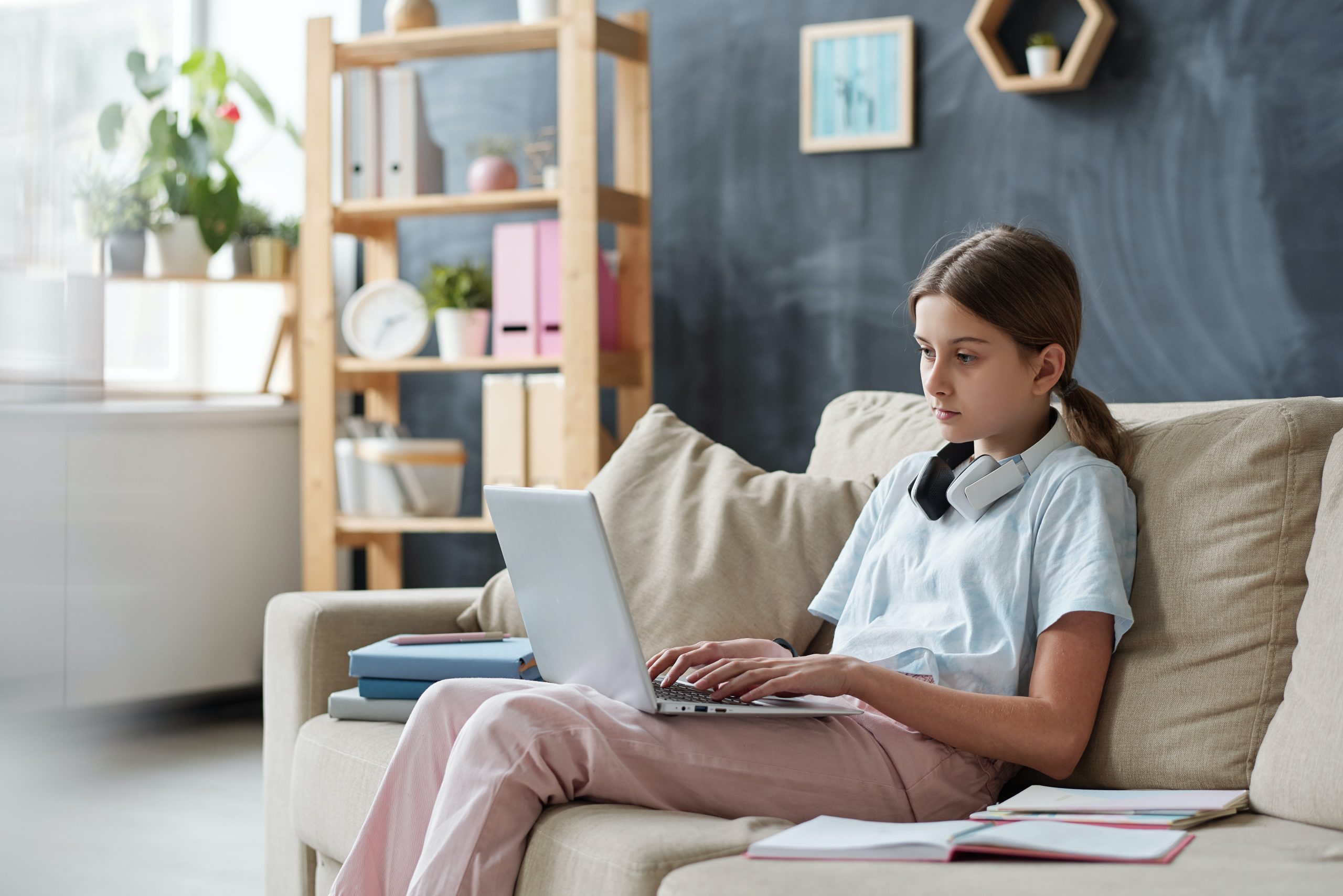 Teen working on laptop