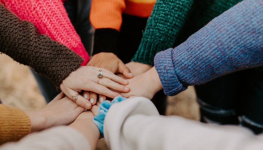 Hands stacked together