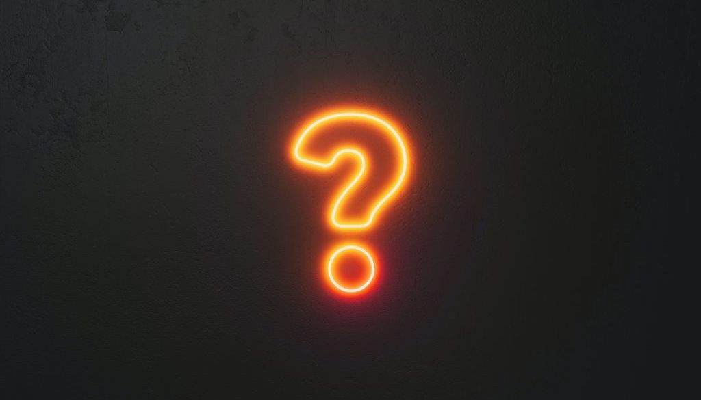 Orange neon question mark sign against black wall